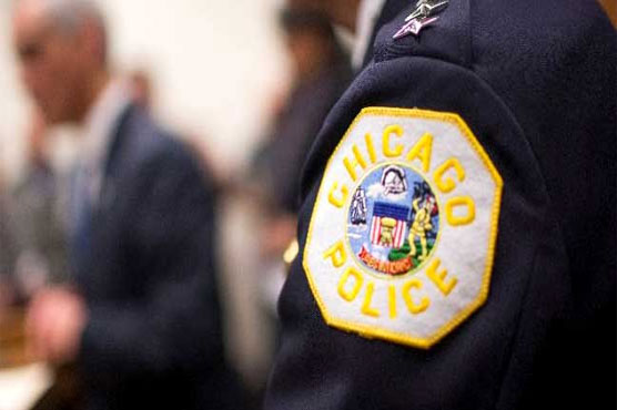 Seven Chicago cops face firing over black teen's shooting death