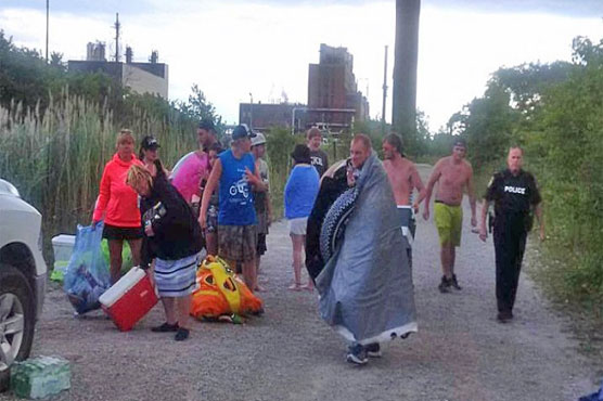 Hundreds of Americans wash up illegally in Canada after river party