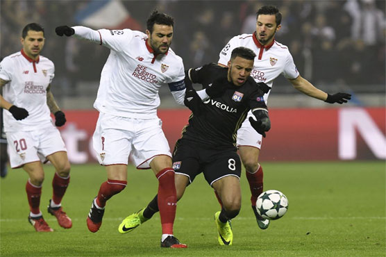 Football: Sevilla withstand Lyon assault to reach last 16