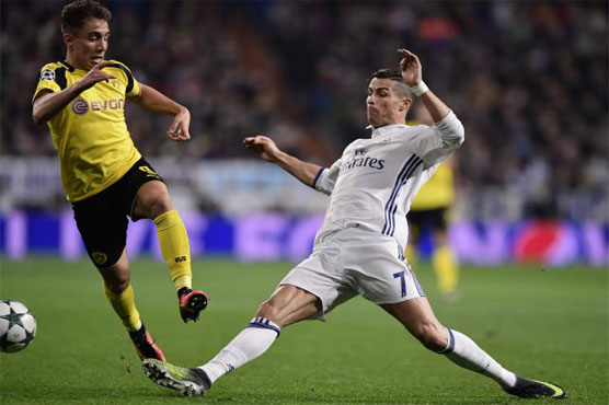 Football: Dortmund strike late, beat Madrid to top spot
