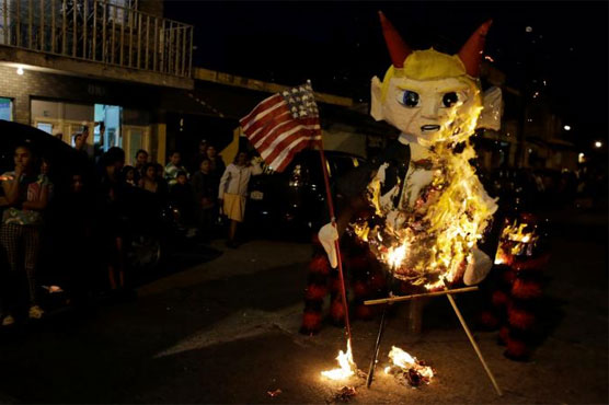 Guatemalans burn Trump effigies to scatter evil spirits