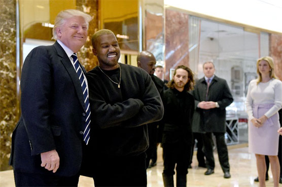 Kanye West emerges from hospital to meet Trump