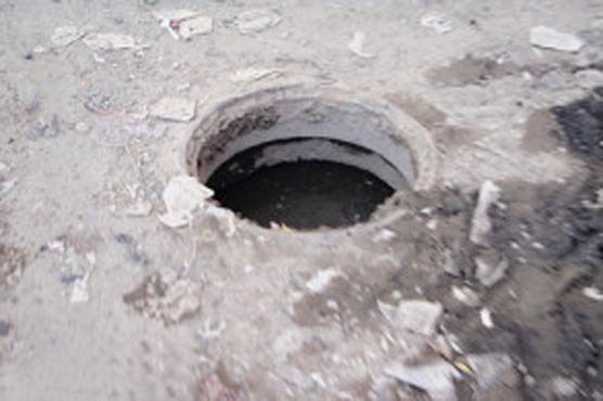 Boy dies after falling into open manhole