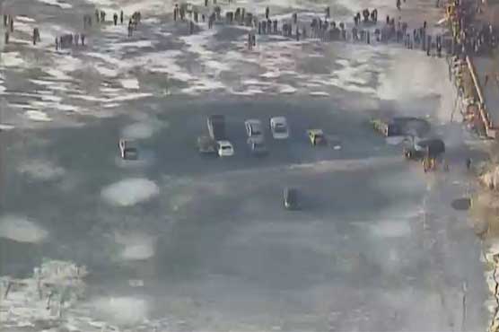 Cars parked on thin ice get icy bath in Wisconsin