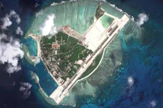 China confirms "weapons" on disputed island