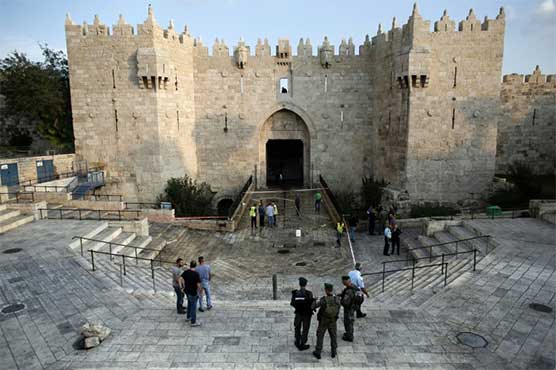 Police guns and cameras at Jerusalem's Damascus gate