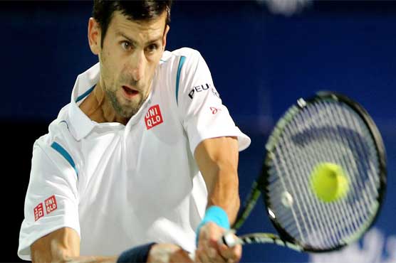 Tennis: Djokovic eases into 700-win club in Dubai