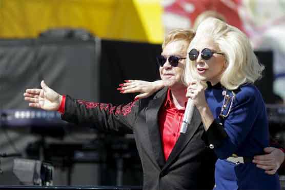 Elton John gives surprise LA concert with Lady Gaga as guest