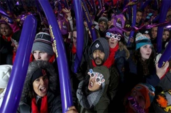 New Year's Eve revelers pack NYC's Times Square under tight security