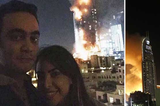 First 'most inappropriate selfie of the year': Smiling couple in front of burning Dubai hotel