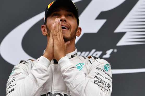 Hamilton survives Rosberg battering to win