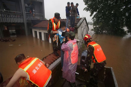 China floods leave more than 100 dead or missing: report
