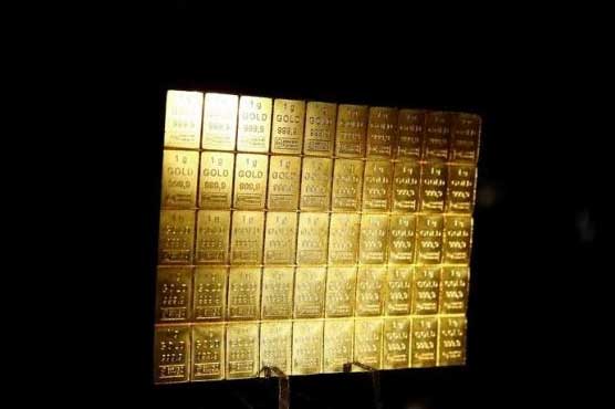 Gold races to 28-month high, oil slides on renewed Brexit fears