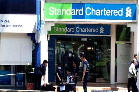 Singapore police hunt bank 'note' robber