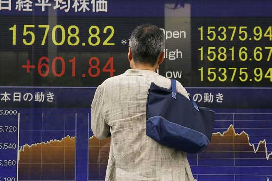 Tokyo shares open higher on weaker Yen, stimulus hopes