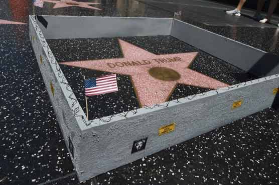 Artist builds wall around Trump's Hollywood star