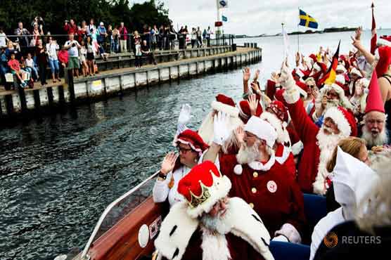 Santas from all over the world meet to talk shop