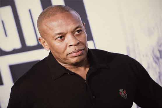 Rap tycoon Dr. Dre handcuffed outside home