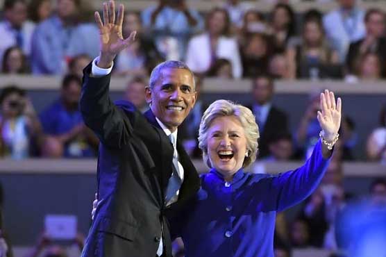 Obama passes torch to Clinton, warns election is test of US democracy