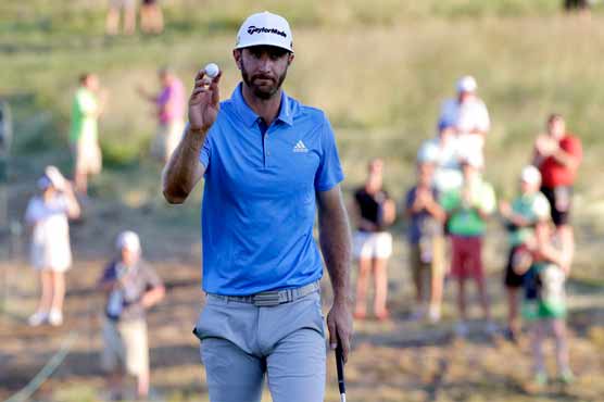 Golf: Marathon man Johnson in share of US Open lead