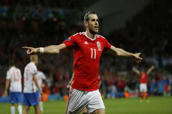 Football: Bale inspires as brilliant Wales into last 16