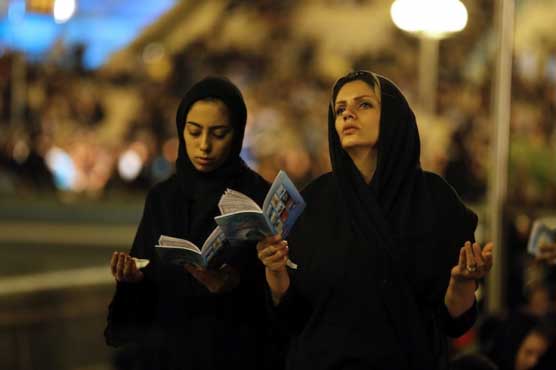 Iranians pray for peace on holy night