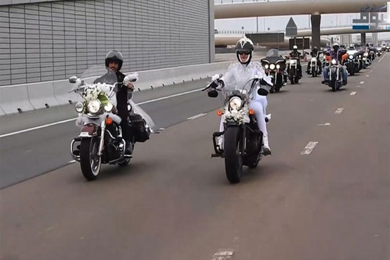 Newlywed in Abu Dhabi celebrate marriage while riding bikes around city