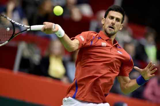 Djokovic, Murray shine in tense Davis Cup