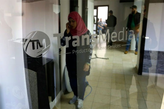 Israel raids Palestinian TV station accused over unrest