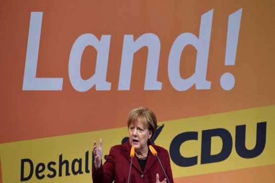 Refugees have duty to integrate, Merkel says before regional vote