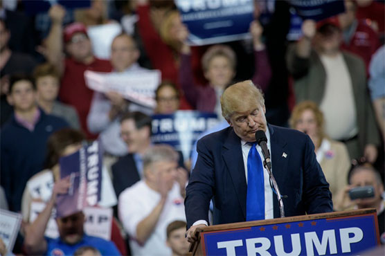 Defiant Trump stares down protesters after rally violence