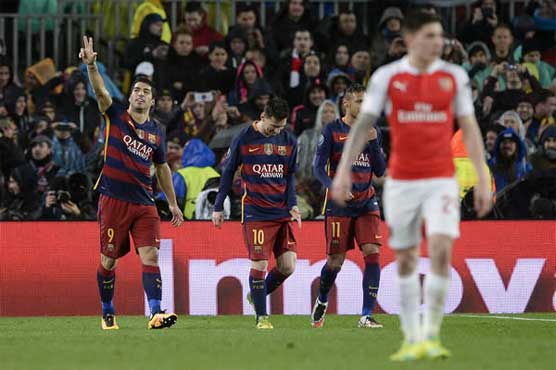 Football: Barca star trio outgun Arsenal to reach quarters