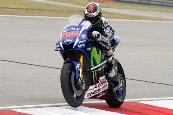 Motorcycling: Lorenzo, Rossi strike first blows in Qatar