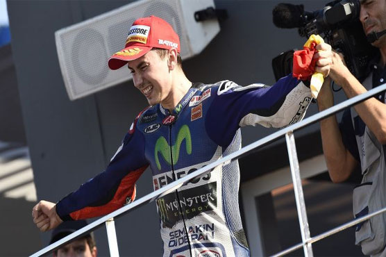 Motorcycling: World champion Lorenzo claims Qatar triumph