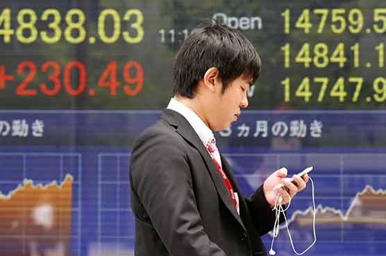 Tokyo shares jump in morning trade on weaker Yen