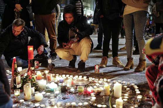Grieving Brussels holds vigil at historic city square