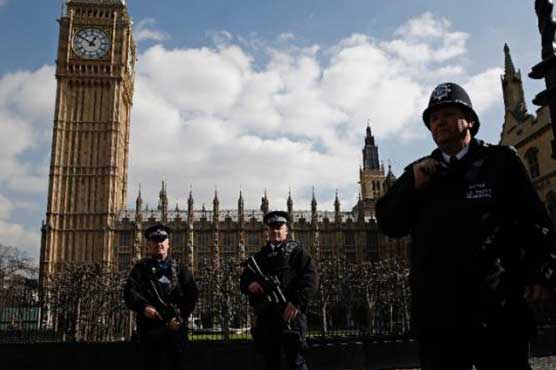 UK tightens security as PM urges joint stand after Brussels