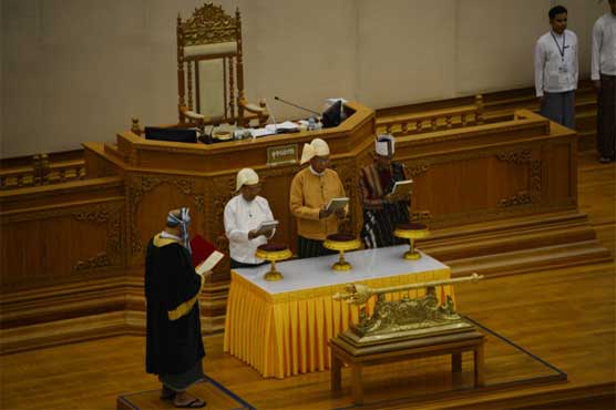 Myanmar swears in first president with no army ties in more than 50 years
