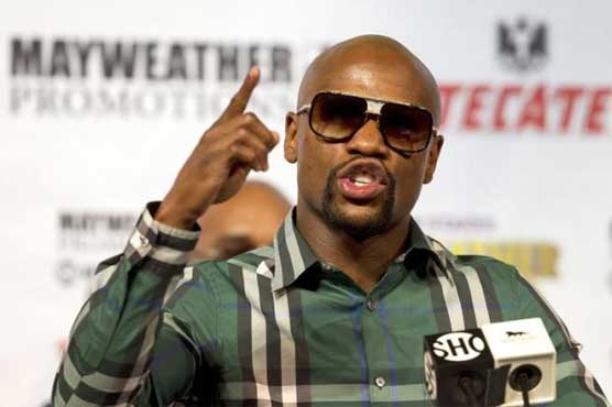 Mayweather happy in retirement but hints at ring return