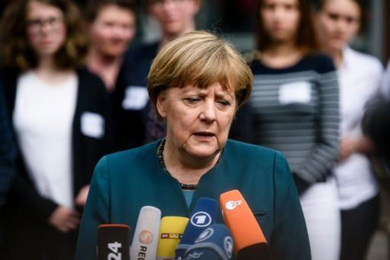 Merkel lends backing to halt rise of France's far-right