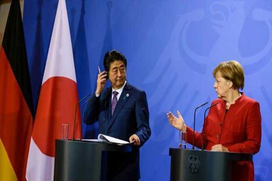 Merkel, Abe differ on how to fix world economy