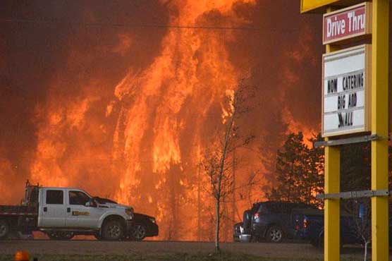 'Catastrophic wildfires' force thousands to flee in Canada