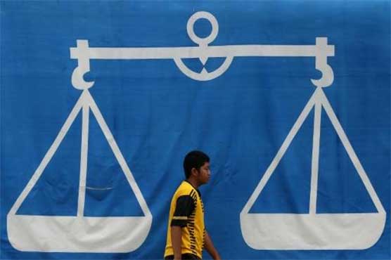 Malaysia's largest state votes, in test for embattled PM 