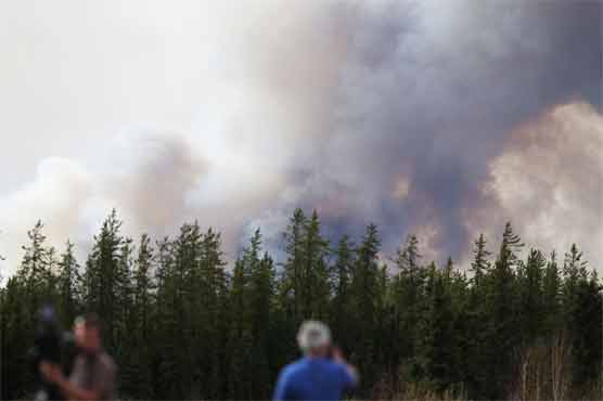 Canada fires now advancing more slowly