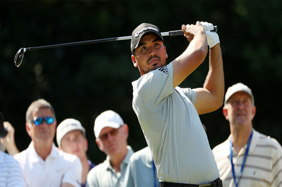 Golf: Day matches course record 63 to lead at Players