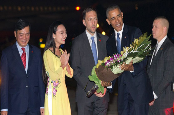 Obama lands in Vietnam to boost security, trade ties