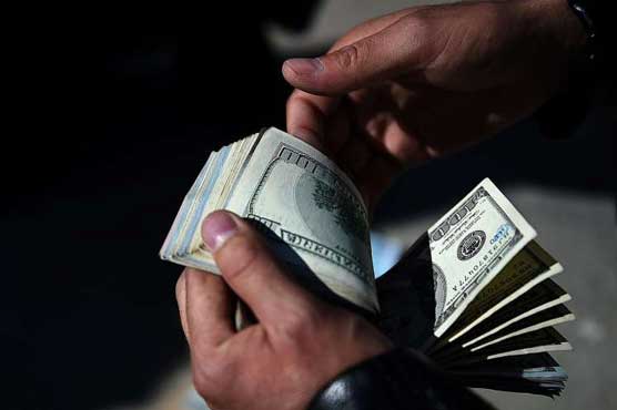 Oil dips as Dollar rallies on news of possible US rate hike