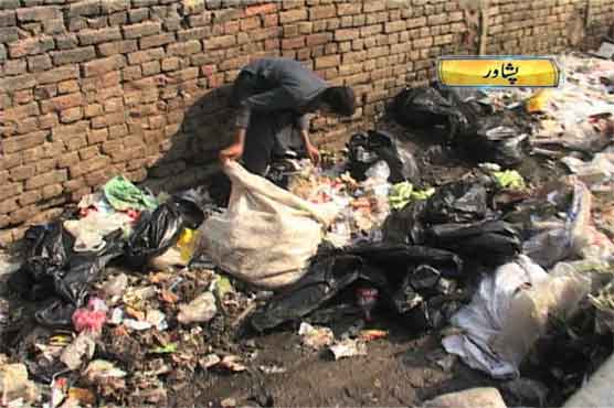 Poverty-stricken children pick through deaths from rubbish