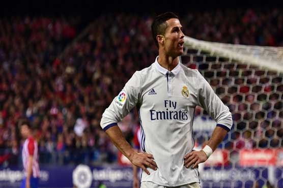 Ronaldo hat-trick downs Atletico, extends Real lead 