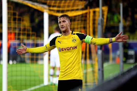 Football: Hat-trick delights Reus, Tuchel in record win